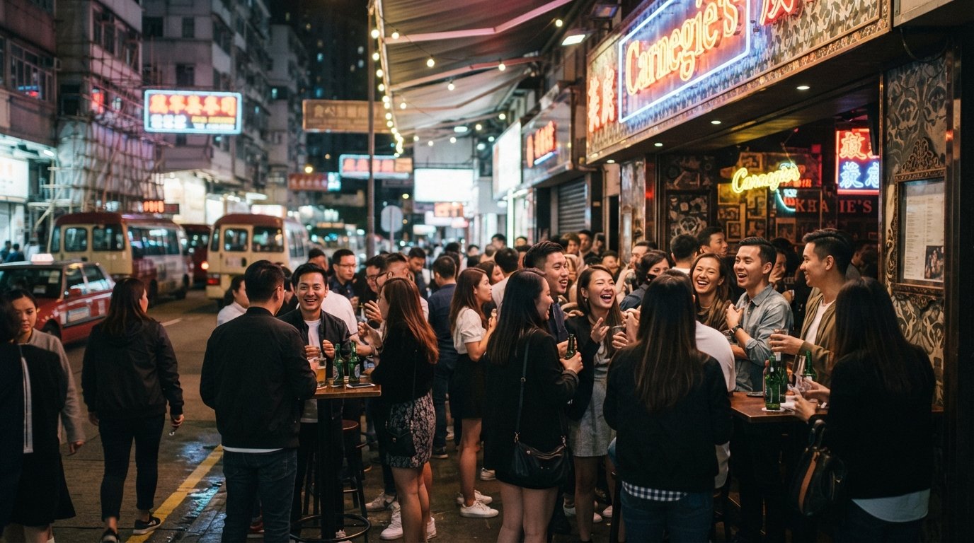 Carnegie's on Lockhart Road in Wan Chai, neon-lit bar frontage with a crowd gathered outside at night